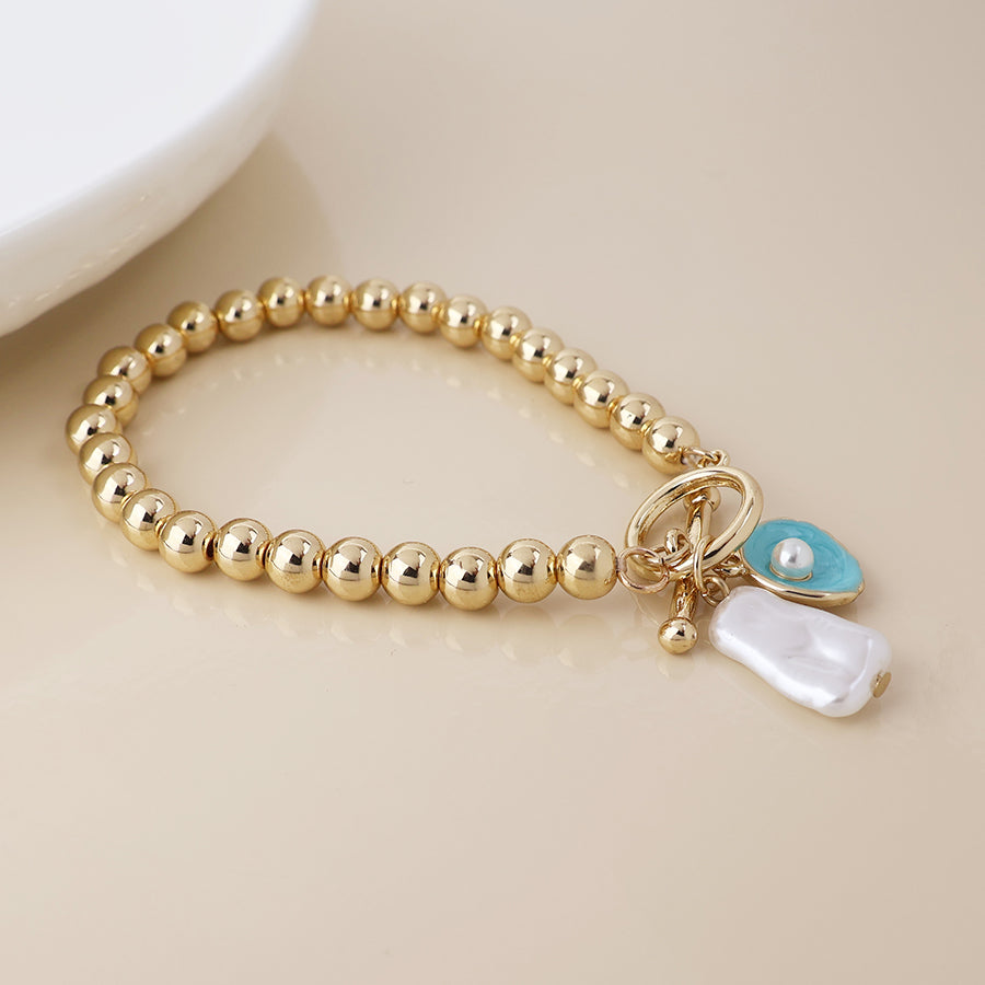 T-bar Bracelet With Shell and Pearl Charms | Gold