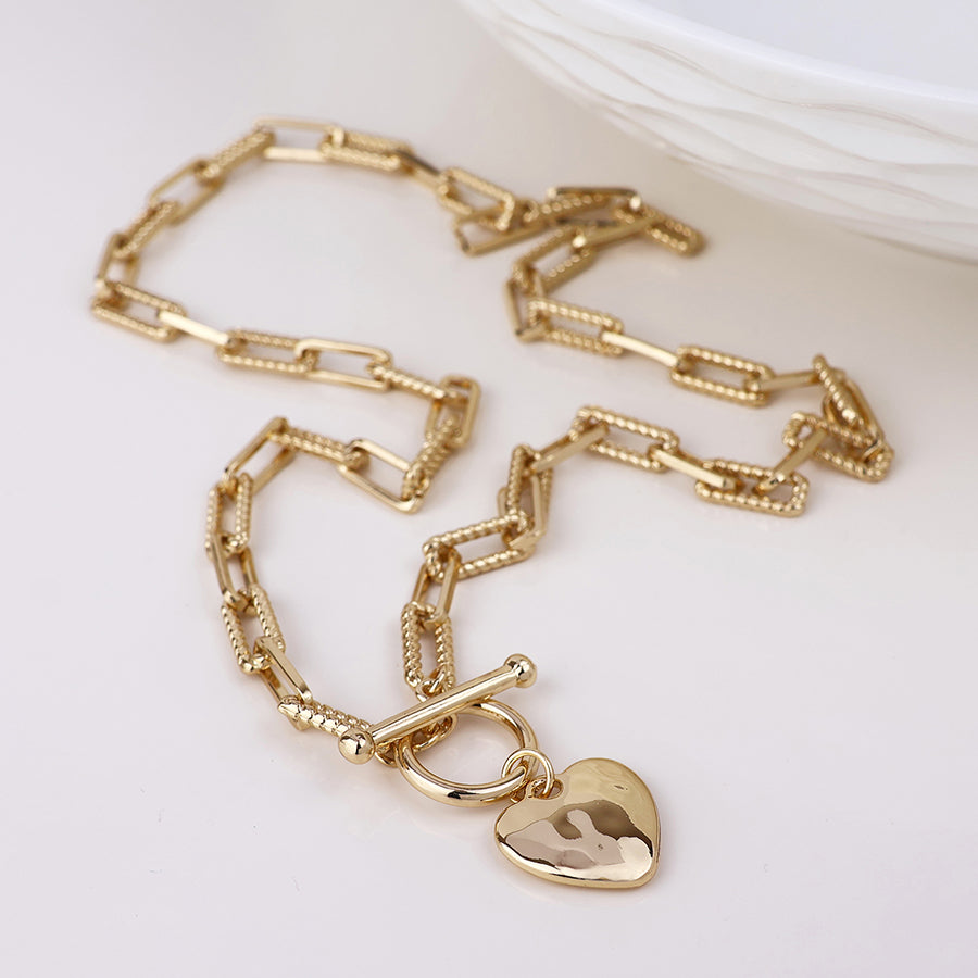 Foundry golden heart and t-bar necklace with twist links
