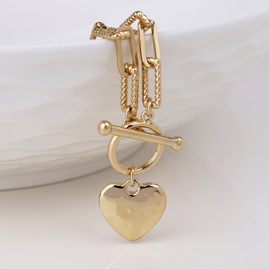Foundry golden heart and t-bar necklace with twist links