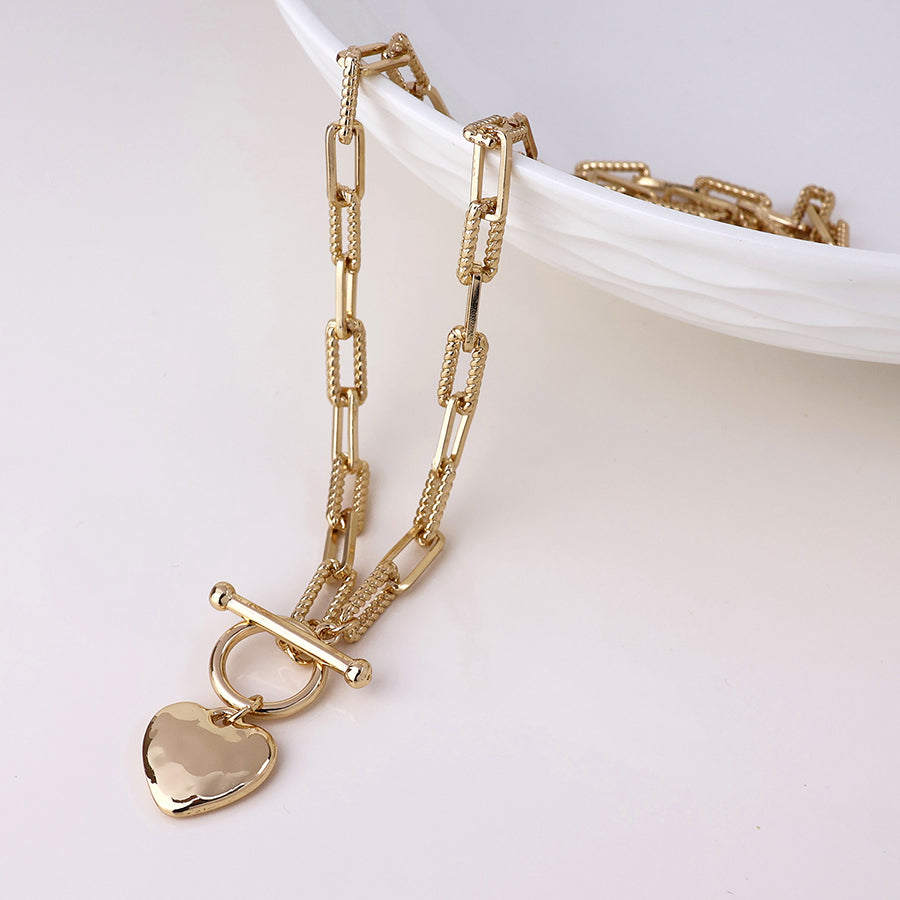 Foundry golden heart and t-bar necklace with twist links