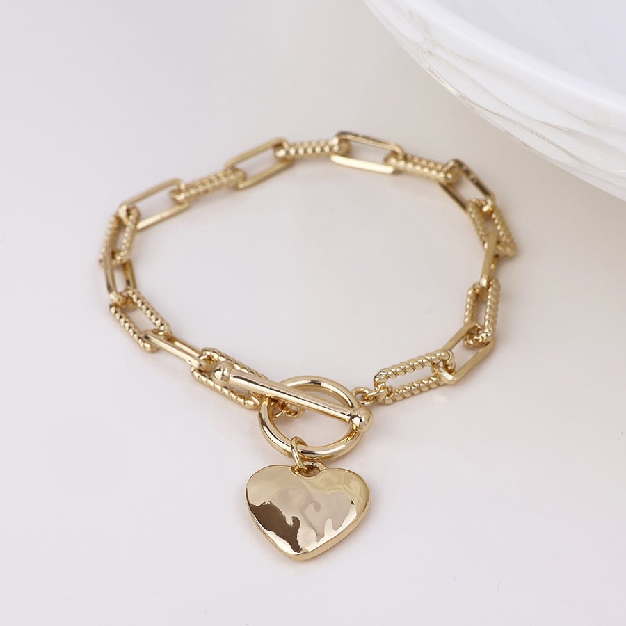 Foundry golden heart and t-bar bracelet with twist links