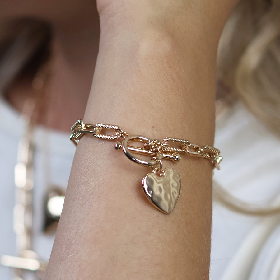 Foundry golden heart and t-bar bracelet with twist links