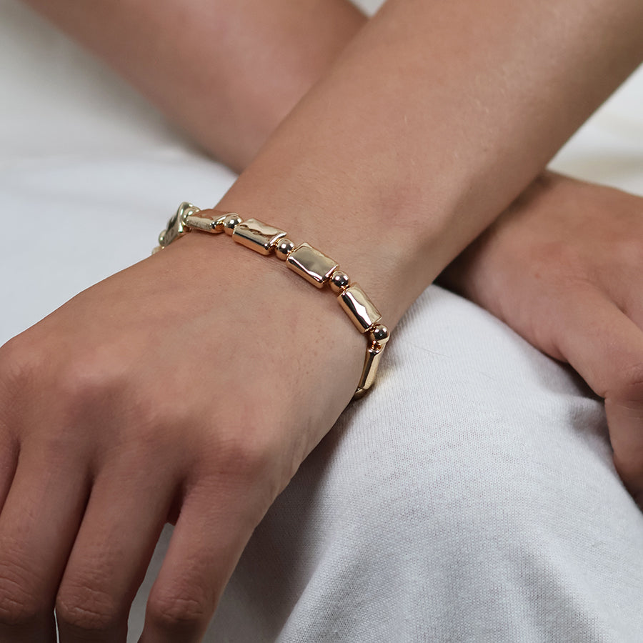 Cassia golden polished bead and oblong stretch bracelet