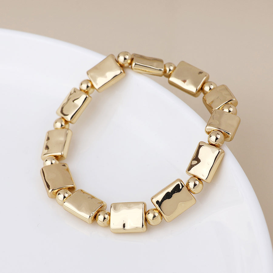 Cassia golden polished bead and oblong stretch bracelet
