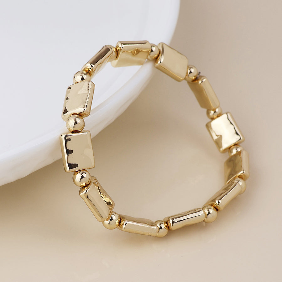 Cassia golden polished bead and oblong stretch bracelet