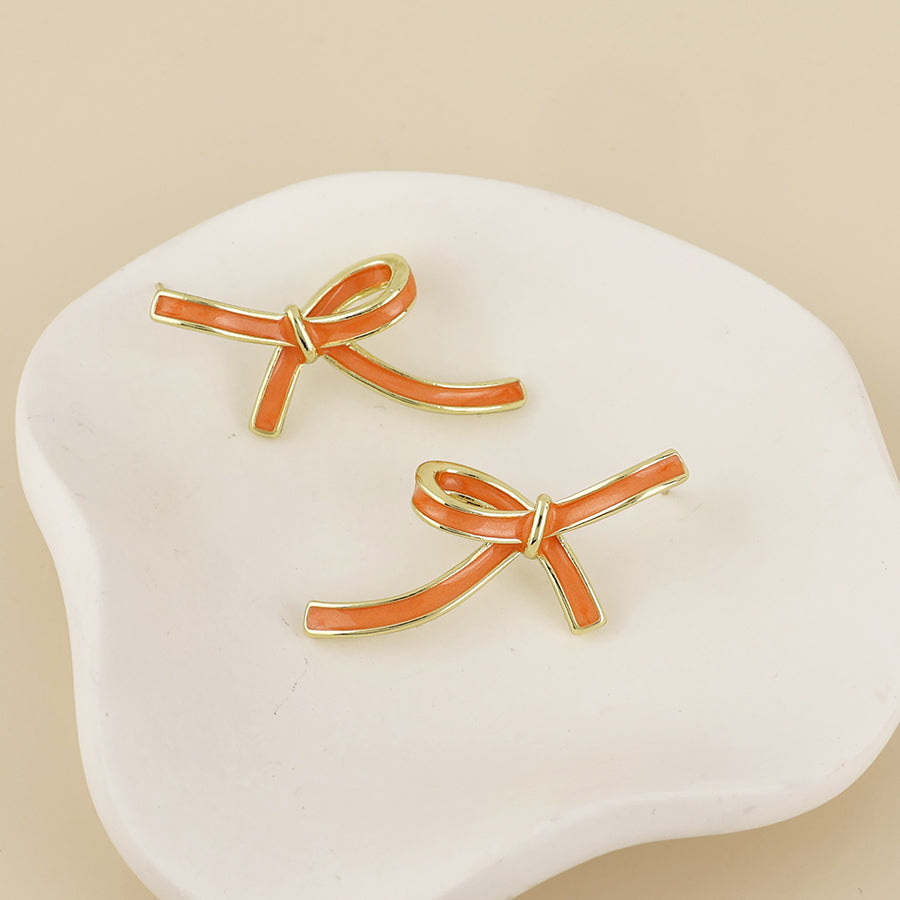 Seraphina Stainless Steel Orange Enamel Bow Earrings | Gold Plated