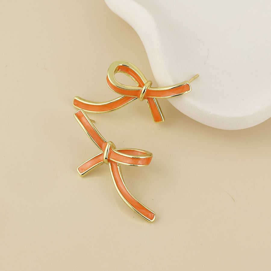 Seraphina Stainless Steel Orange Enamel Bow Earrings | Gold Plated